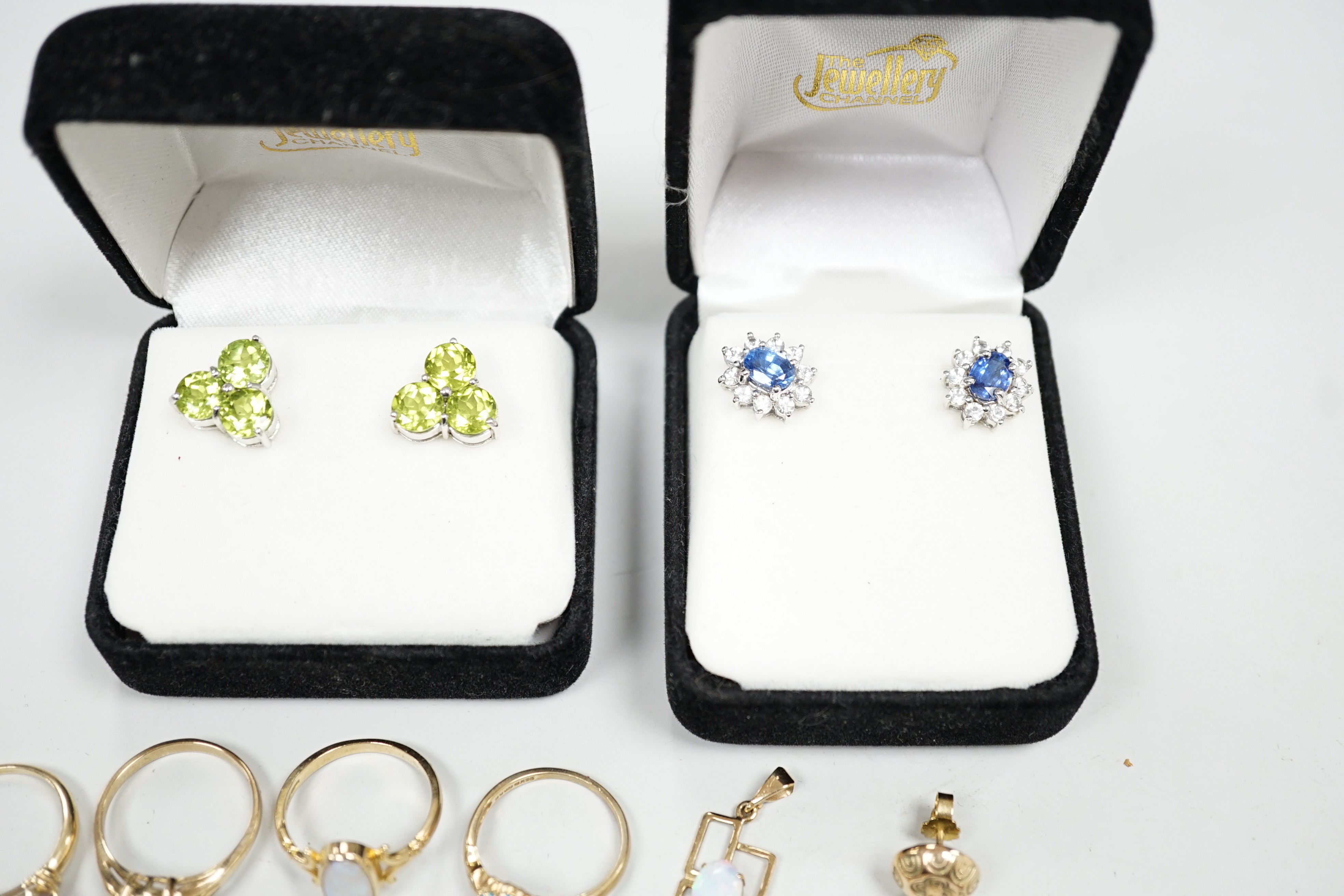 Four assorted modern 9ct gold and gem set rings including two white opal, gross weight 9.4 grams, two pairs of modern 9ct gold and gem set ear studs and other minor jewellery.